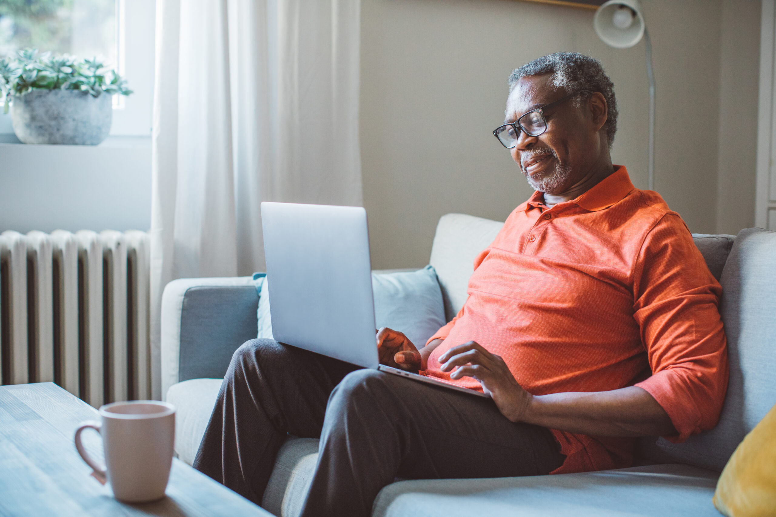 eteran sitting on couch reviewing documents to increase your VA disability rating